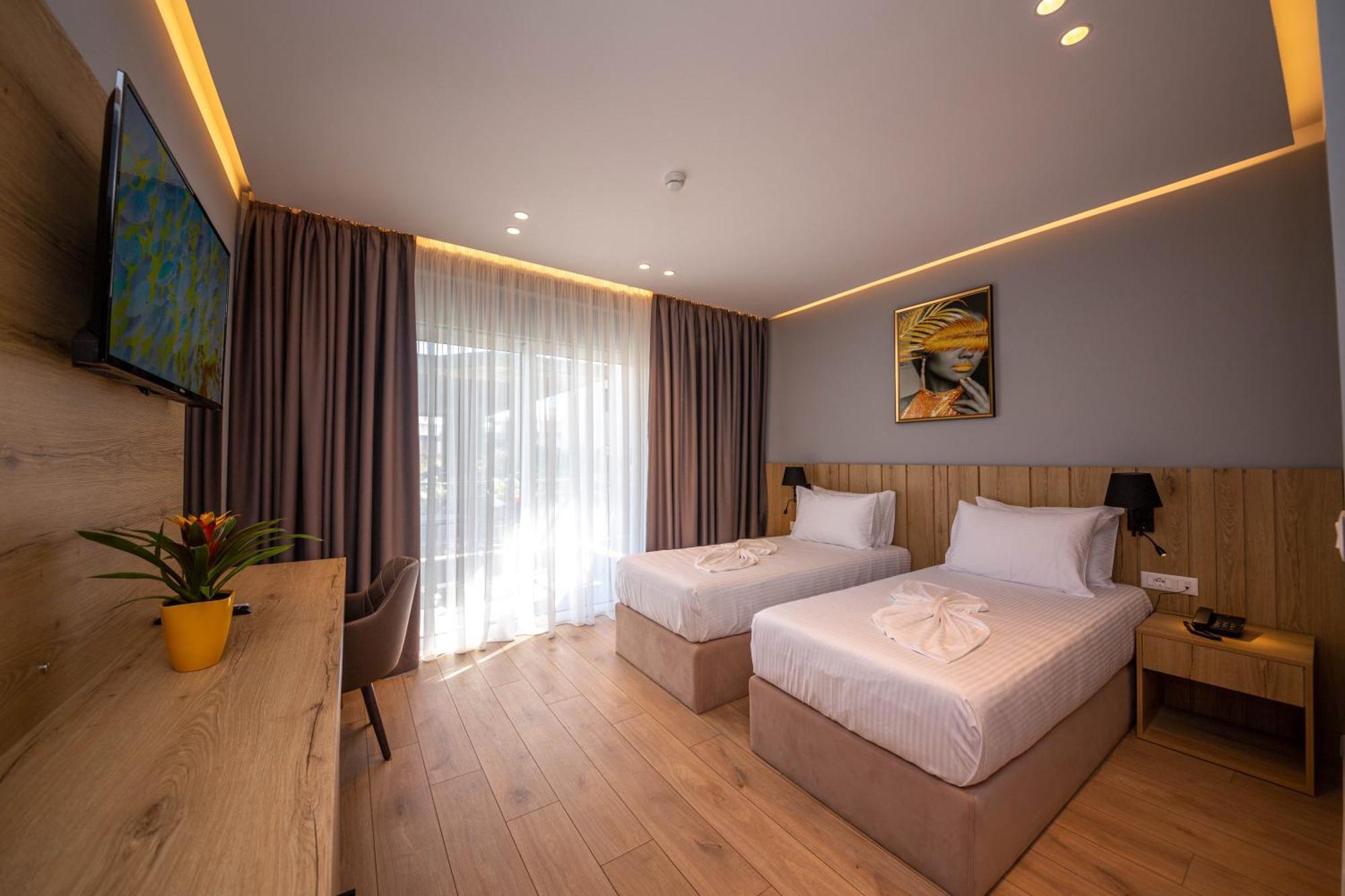 Deluxe Double or Twin + Sofa Bed with Balcony and Side Sea View